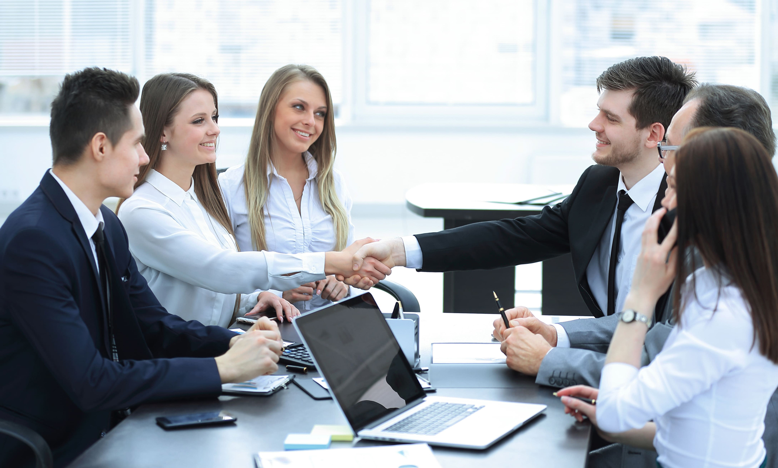 business partners shaking hands after a successful transaction 1